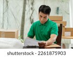 Solopreneur filling documents before sending order to his customers