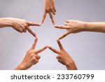 People forming star shape with...