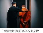 Small photo of Police officer walking suspect to interrogation room, view from the back