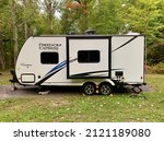 Small photo of Dexter, Wisconsin, U.S.A. February, 7, 2022 Coachman Freedom Express Camper, Coachmen is a Forest River Inc. brand of camper