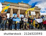 Small photo of Berlin, Germany - 19 Feb 2022: Protest near Brandenburg Gate against Russian military threats of a big war against Ukraine. Hundreds of protesters declare solidarity with Ukraine
