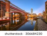 View of Manchester tallest building Beetham Tower, reflecting in Manchester Canal.