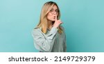 Small photo of young pretty blonde woman asking for silence and quiet, gesturing with finger in front of mouth, saying shh or keeping a secret