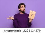 Small photo of young bearded man with a question mark
