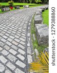 Small photo of Cobbled footpath going from the Ravelin of the Royal Gate-Revellin de Puerta Real fort off the curtain wall to the Royal Gate at the southern rampart of Intramuros-Inner Walled city-Manila-Philippines