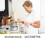 Grandmother Cooking In The...