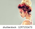 Beautiful model girl  with elegant  multi colored hairstyle . Stylish Woman with fashion  hair  color highlighting.   Creative  red and pink roots ,   trendy  coloring. 