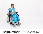 Small photo of Young Asian woman sitting on wheelchair and wearing patient outfits and put on a soft splint due to a broken arm isolated on white background, Personal accident concept
