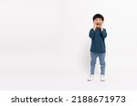Small photo of Asian little boy standing and open mouths raising hands screaming announcement isolated on white background, Full body composition and five years old