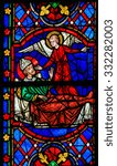 Small photo of TOURS, FRANCE - AUGUST 14, 2014: Stained glass window depicting a Saint on his deathbed, called by an Angel, in the Cathedral of Tours, France.