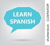 learn spanish written on speech ... | Shutterstock .eps vector #1136964539