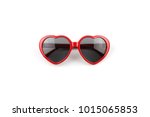 Red heart shaped sunglasses isolated on white background, summer holidays, valentines day, travel.