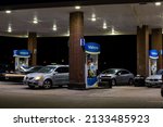 Small photo of Plano, Texas, USA - December 17th, 2021: Busy Valero Gas station at night