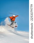 Small photo of Free-rider skier jumps and has fun in powder snow