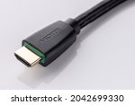 close up shot of High Definition Multimedia Interface, HDMI male connector cable with braid on white background