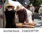 Small photo of Craiova, Dolj County, Romania – May 14, 2022: Medieval craftsmen in authentic historical clothing at a medieval festival Michael le Brave ( Mihai Viteazul ). Reconstruction of activities from a medi