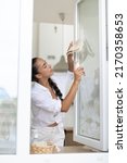 woman cleaning window at home... | Shutterstock . vector #2170358653