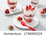Small photo of Dessert of whipped cream and fresh strawberries.