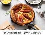 Toad in the hole, Sausage Toad, traditional English dish of sausages in Yorkshire pudding batter. 