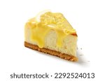 Slice of fresh baked homemade lemon cheesecake with lemon curd and lemon slices. isolated on white background