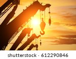 silhouette crane truck in flare light for logistic background 