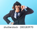Monkey man doing bad signal over colorful background