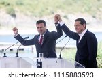 Small photo of Prespes - Greece, June 17, 2018 : Greek Prime Minister Alexis Tsipras (R) and his Macedonian counterpart Zoran Zaev (L) during a signing agreement for Macedonia's new name in the village of Psarades