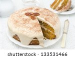 carrots and pumpkin cake with coffee cream in a cut on the plate