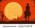 Silhouette Of Cowboy Riding...