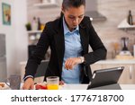 Small photo of Woman hurrying up to finish breakfast while she's late at the meeting. Young freelancer working around the clock to meet her goals, stressful way of life, hurry, late for work, always on the run