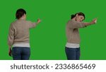 Small photo of Optimistic adult asking people to come over, being insistent and requesting to come. Young casual adult calling person over, expressing positive joyful emotions over studio greenscreen.