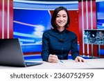 Small photo of Asian presenter on daily newscast in newsroom, talking about latest international events on live broadcast. Woman reporter creating television content with media outlets headlines.