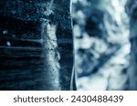 Small photo of Icelandic glacier ice blocks in crevasse, frozen wintry landscapes with transparent rocks inside ice caves. Water dripping from cracked texture caverns of ice in iceland, vatnajokull.