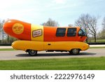 Small photo of Plymouth, Wisconsin USA - May 27, 2019: Oscar Mayer's famous promotional wiener wagon is an icon of American advertising. This is a photo of a replica, driving on a rural road.