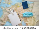 Travel in epidemic quarantine notes template. Table top view with map, plane, notebook, face mask, passport, medical gloves. personal hygiene and protection items in tourism theme. restrictions