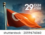 Small photo of Turkey flag waving in the wind over dramatic cloudy sky during sunrise. "29 Ekim Cumhuriyet Bayrami Kutlu Olsun." Translation: "October 29, Happy Republic Day of Turkey." National holiday of Turkey.