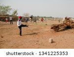 Small photo of JUBA, SOUTH SUDAN - FEBRUARY 26 2012: Unidentified kids from displaced persons camp play on street of Juba, South Sudan. Juba is full of refugees who live with their children in appalling conditions.