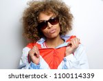 Close up portrait of cool young black woman with sunglasses