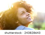 Close up portrait of a beautiful young african american woman smiling and looking up