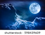 Super moon. Attractive photo of background night sky with cloudy and bright full moon. Nightly sky with beautiful full moon. The moon were NOT furnished by NASA.