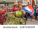 Small photo of Villach, Austria - August 6, 2022: Participants from Paraguay enjoy the procession of 'Villacher Kirchtag', the largest traditional folk festival in Austria, after years of cancellation due to Covid.