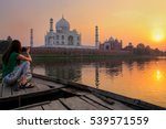 Woman Watching Sunset Over Taj...