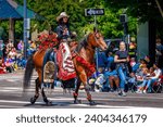 Small photo of Portland, Oregon, USA - June 10, 2023: Miss Thunder Mountain Pro Rodeo Queen, Marley Cooper, in the Grand Floral Parade, during Portland Rose Festival 2023.