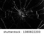 Cracks in the glass on a black background. Abstraction