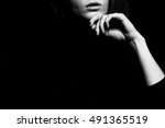 Small photo of Femme fatale concept. Old classic movies actress style. Close up profile portrait of gorgeous young woman with beautiful hands over black background. Black and white studio shot Copy-space