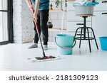 cute teenage boy do household chores, men housework, household help in stylish kitchen in modern apartment, doing laundry and mopping floors, mom's housemate, little helper