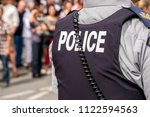Small photo of Montreal, CA - 14 August 2016: Back of the bulletproof vest of a Royal Canadian Mounted Police sergeant