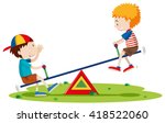 Two Boys Playing Seesaw In The...