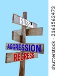 Small photo of Wooden road sign with words war, russia, insane, sanctions, aggression, regress