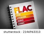 Small photo of FLAC - Free Lossless Audio Codec is an audio coding format for lossless compression of digital audio, acronym technology concept on notepad